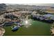 Expansive aerial shot of a lakeside community, featuring a mix of residential and commercial buildings at 8 Via Dolcetto, Henderson, NV 89011