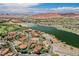 Stunning aerial view of a luxurious lakeside community with golf courses, mountains, and beautiful homes at 8 Via Dolcetto, Henderson, NV 89011