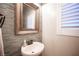 Half bathroom with a designer sink, mirror, and soft, neutral tones at 8 Via Dolcetto, Henderson, NV 89011