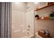 Bathroom with a shower and tub combination and open shelving for storage at 8 Via Dolcetto, Henderson, NV 89011