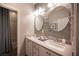 Bathroom with double sinks, decorative mirrors, and modern fixtures at 8 Via Dolcetto, Henderson, NV 89011