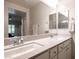 Bathroom features double sinks, sleek countertops and lots of natural light at 8 Via Dolcetto, Henderson, NV 89011
