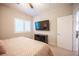 Cozy bedroom with carpet, ceiling fan, and large window with wooden shutters at 8 Via Dolcetto, Henderson, NV 89011
