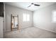 Simple bedroom with gray carpet and a large mirror at 8 Via Dolcetto, Henderson, NV 89011