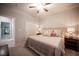 Bedroom with ceiling fan, neutral colors, and decorative pillows at 8 Via Dolcetto, Henderson, NV 89011