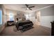 A serene bedroom features plush carpeting, a ceiling fan, and modern decor at 8 Via Dolcetto, Henderson, NV 89011