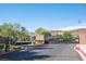 Gated community entrance with stone columns, manicured landscaping, and a secure entry system at 8 Via Dolcetto, Henderson, NV 89011