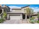 Beautiful two-story home featuring a two-car garage and landscaped front yard and gated entry at 8 Via Dolcetto, Henderson, NV 89011