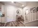 Elegant foyer featuring hardwood floors, staircase, and stylish decor, creating a welcoming entrance at 8 Via Dolcetto, Henderson, NV 89011