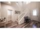 Inviting foyer with wood floors, a staircase, and natural light, creating a bright and open entrance at 8 Via Dolcetto, Henderson, NV 89011