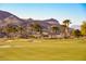 Beautiful golf course with palm trees, bunkers, and mountain views in a serene setting at 8 Via Dolcetto, Henderson, NV 89011