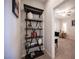 Hallway view leading to the office space with decoratively shelved bookcase at 8 Via Dolcetto, Henderson, NV 89011