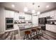 Modern kitchen with granite countertops, stainless steel appliances, and a stylish island with seating at 8 Via Dolcetto, Henderson, NV 89011