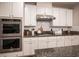 Well-equipped kitchen showcasing stainless steel appliances, granite countertops, and ample cabinet space at 8 Via Dolcetto, Henderson, NV 89011