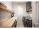 Laundry room with butcher block countertop and stainless steel appliances at 8 Via Dolcetto, Henderson, NV 89011