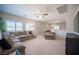 Upstairs loft area featuring neutral carpet, a ceiling fan and lots of natural light at 8 Via Dolcetto, Henderson, NV 89011