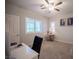 Home office space with a ceiling fan, plantation shutters, and a bright work area at 8 Via Dolcetto, Henderson, NV 89011
