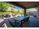 Covered patio with an outdoor seating and a dining table at 8 Via Dolcetto, Henderson, NV 89011
