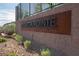 Elegant community signage featuring the name 'Regatta Pointe' on a brick wall with landscaping at 8 Via Dolcetto, Henderson, NV 89011