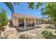 Spacious backyard with a covered patio and well-maintained landscaping, perfect for outdoor enjoyment at 8777 Shady Peak Way, Las Vegas, NV 89123