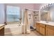 Bathroom with a soaking tub, glass enclosed shower, and vanity with sink at 8777 Shady Peak Way, Las Vegas, NV 89123