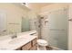 Well-lit bathroom with a glass-enclosed shower, modern vanity, and fixtures, offering a spa-like experience at 8777 Shady Peak Way, Las Vegas, NV 89123