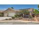 Attractive single-story home with desert landscaping, a two-car garage, and a sunny front facade at 8777 Shady Peak Way, Las Vegas, NV 89123