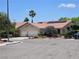 Charming single-story home with a terracotta roof, desert landscaping, and a two-car garage at 8777 Shady Peak Way, Las Vegas, NV 89123
