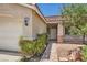 Welcoming front entrance with a brick walkway, desert landscaping, and a charming entryway at 8777 Shady Peak Way, Las Vegas, NV 89123