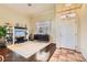 Bright living room featuring hardwood floors, a decorative entertainment center, and a neutral color scheme at 8777 Shady Peak Way, Las Vegas, NV 89123