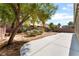 A backyard with a cement patio and desert landscaping at 908 Cypress Gold Ct, North Las Vegas, NV 89031