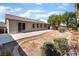 This backyard has a patio and desert landscaping at 908 Cypress Gold Ct, North Las Vegas, NV 89031