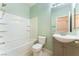 This bathroom has a tub/shower combo and a vanity with a sink at 908 Cypress Gold Ct, North Las Vegas, NV 89031
