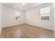 This bedroom features wood-look floors and windows at 908 Cypress Gold Ct, North Las Vegas, NV 89031