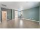 This airy bedroom features durable wood-look flooring, fresh paint, and ample space at 908 Cypress Gold Ct, North Las Vegas, NV 89031