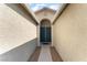Inviting entrance with double doors and attractive archway, creating a welcoming ambiance at 908 Cypress Gold Ct, North Las Vegas, NV 89031