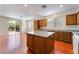 Bright kitchen featuring an island, ample counter space, and backyard access at 908 Cypress Gold Ct, North Las Vegas, NV 89031