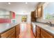 Open-concept kitchen with granite countertops, wood cabinets and stainless steel appliances at 908 Cypress Gold Ct, North Las Vegas, NV 89031
