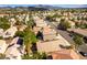 An aerial view of a neighborhood featuring homes with desert landscaping and mountain views at 922 Lloyd George Dr, Henderson, NV 89052