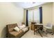Bedroom or bonus room with a futon, desk, and louvred window coverings at 922 Lloyd George Dr, Henderson, NV 89052
