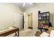 Cozy bedroom featuring a ceiling fan, closet, and built-in bookcase for storage and display at 922 Lloyd George Dr, Henderson, NV 89052