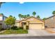 Charming single-story home featuring a well-manicured lawn, mature landscaping, and a two-car garage at 922 Lloyd George Dr, Henderson, NV 89052