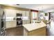 Bright kitchen featuring an island with seating, stainless steel appliances, and a modern design at 922 Lloyd George Dr, Henderson, NV 89052