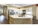 Spacious kitchen featuring white cabinets, stainless steel appliances, and quartz countertops at 922 Lloyd George Dr, Henderson, NV 89052