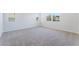 Spacious bedroom featuring neutral decor, plush carpeting, and large windows at 9314 Observatory St, Las Vegas, NV 89143