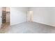 Spacious bedroom with soft carpet, access to a walk-in closet, and a freshly painted interior at 9314 Observatory St, Las Vegas, NV 89143
