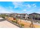 New residential construction with a playground for the community in the foreground on a beautiful day at 9314 Observatory St, Las Vegas, NV 89143