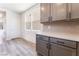 Well-lit kitchen featuring gray cabinetry, stylish backsplash, and stainless appliances at 9314 Observatory St, Las Vegas, NV 89143