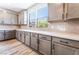 Modern kitchen with gray cabinets, sleek countertops, and stainless steel appliances at 9314 Observatory St, Las Vegas, NV 89143