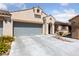 Charming single-story home with a two-car garage and inviting desert landscaping at 9393 New Utrecht St, Las Vegas, NV 89178